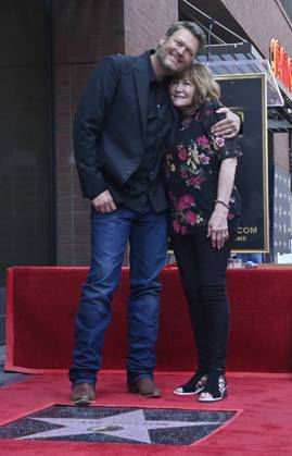 Singer and entertainer Blake Shelton is joined by his mother Dorothy Shackleford during an unveiling ceremony honoring him with the 2,755th star on the Hollywood Walk of Fame on Friday, May 12, 2023.  LAP2023051217 JIMxRUYMEN