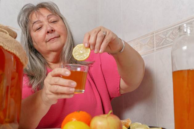woman drinking a glass of fermented kombucha tea with natural lime older white-haired woman drinking a glass of fermented kombucha tea with natural lime ,model released, Symbolfoto Copyright: xZoonar.com josexhernandezxantonax 19649740 ,model released, Symbolfoto ,property released