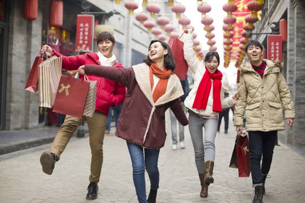 Happy young Chinese friends shopping for Chinese New Year Beijing China Copyright: xLianxFeix bji05210155