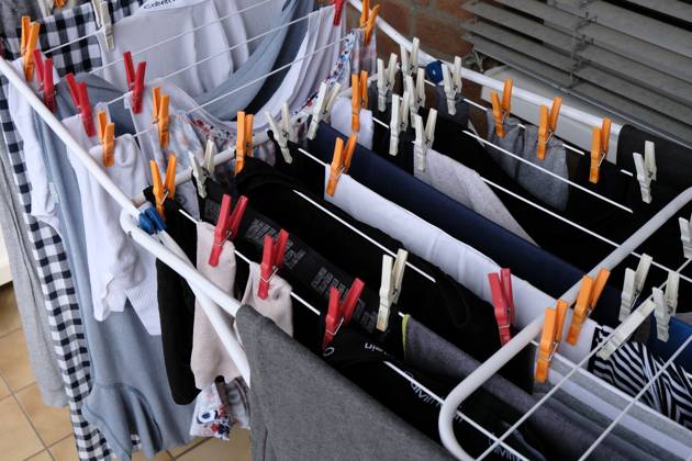 Dusseldorf 20 05 2023 clothes horse colorful clothes line clothespins sustainable environmentally friendly wet laundry air drying balcony solar energy wind energy sunlight solar heat solar heat save electricity no clothes dryer power consumption Dusseldorf North Rhine Westphalia Germany