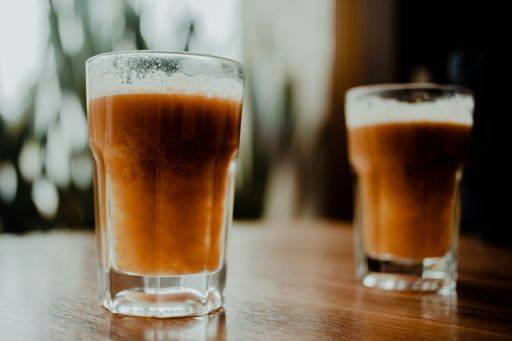 The two glasses of Tamarind drink on a wooden table *** der Zwei Brille des Tamarinde trinken am einer hölzern Tisch 18599499 RECORD DATE NOT STATED