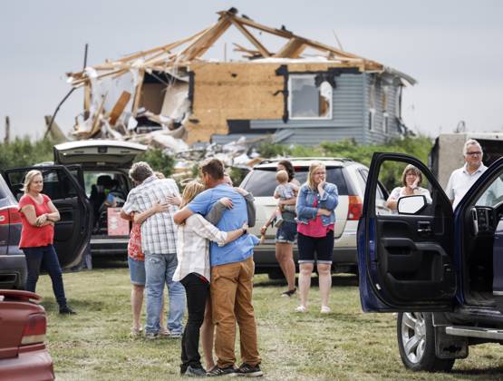 July 1, 2023, Carstairs, AB, CANADA: People embrace after a tornado damaged homes near Carstairs, Alta., Saturday, July 1, 2023. No injuries were reported. Carstairs CANADA  - ZUMAc35_ 20230701_zaf_c35_141 Copyright: xJeffxMcintoshx