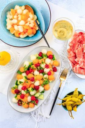 Summer light food. Cucumber and melon salad with raspberries and Prosciutto and pickled hot peppers Summer light food. Cucumber and melon salad with raspberries and Prosciutto and pickled hot peppers Copyright: xZoonar.com IngridxBalabanovax 20436674