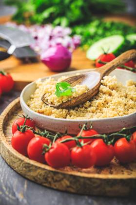 Preparing traditional oriental salad Tabouleh with couscous or bulgur Preparing traditional oriental salad Tabouleh with couscous or bulgur, ingredients on cutting board Copyright: xZoonar.com IngridxBalabanovax 20448928