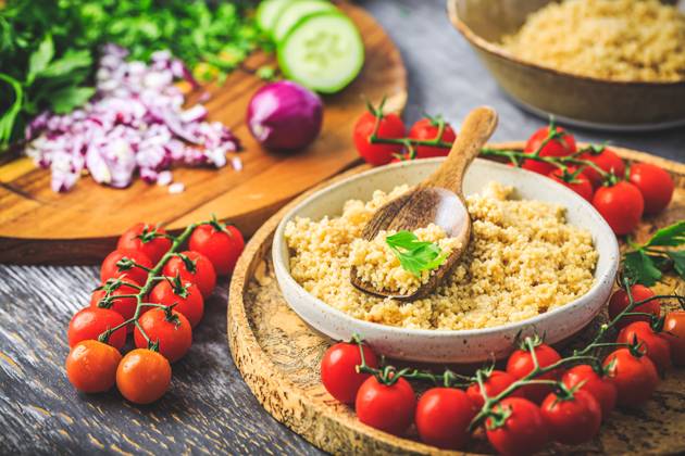 Preparing traditional oriental salad Tabouleh with couscous or bulgur Preparing traditional oriental salad Tabouleh with couscous or bulgur, ingredients on cutting board Copyright: xZoonar.com IngridxBalabanovax 20448930