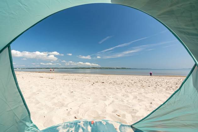 View from inside a tent onto beautiful white sand beach at the Baltic Sea at the Flensburger Förde in North Germany View from inside a tent onto beautiful white sand beach at the Baltic Sea at the Flensburger Förde in North Germany Copyright: xZoonar.com FranziskusxvonxLuckex 20486889