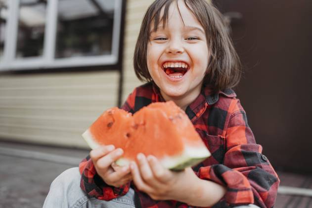 Creative Highlights Symbolbilder Cheerful boy holding fresh watermelon slice model released, Symbolfoto property released, ANAF01553