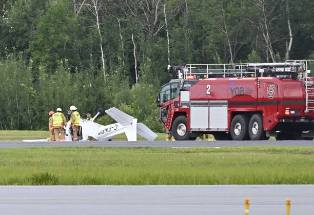 August 1, 2023, QUEBEC CITY, PQ, Canada: Firefighters look over a Cessna 152 aircraft after it crashed on landing at the Jean-Lesage Airport on Tuesday, Aug. 1, 2023 in Quebec City. One person was reported injured. QUEBEC CITY Canada  - ZUMAc35_ 20230801_zaf_c35_021 Copyright: xJacquesxBoissinotx