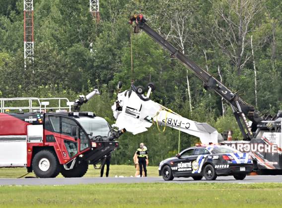 August 1, 2023, QUEBEC, PQ, Canada: A Cessna 152 aircraft is towed away after it crashed on landing at the Jean-Lesage Airport in Quebec City, Tuesday, Aug. 1, 2023. One person was reported injured. QUEBEC Canada  - ZUMAc35_ 20230801_zaf_c35_023 Copyright: xJacquesxBoissinotx
