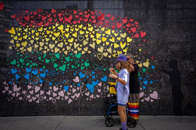 August 6, 2023, VANCOUVER, BC, CANADA: People pass a decorated wall during the Pride Parade at English Bay in Vancouver, B.C., Sunday, Aug. 6, 2023. VANCOUVER CANADA  - ZUMAc35_ 20230806_zaf_c35_019 Copyright: xEthanxCairnsx