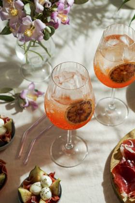 aperol spritz cocktail, on a pale pink linen tablecloth, shadows, sunlight, summer drink in glass aperol spritz cocktail, on a pale pink linen tablecloth, shadows, sunlight, summer drink in glass Copyright: xJuliaxBogdanovax JBO260623-31
