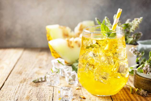Fresh refreshing fruity summer drink, seasonal beverages. Melon lemonade in glasses with ice and mint on a wooden rustic table. Copy space. Fresh refreshing fruity summer drink, seasonal beverages. Melon lemonade in glasses with ice and mint on a wooden rustic table. Copy space. Copyright: xZoonar.com ELENAxHRAMOVAx 20552269