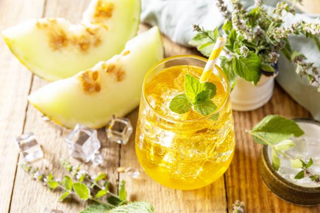 Fresh refreshing fruity summer drink, seasonal beverages. Melon lemonade in glasses with ice and mint on a wooden rustic table. Fresh refreshing fruity summer drink, seasonal beverages. Melon lemonade in glasses with ice and mint on a wooden rustic table. Copyright: xZoonar.com ELENAxHRAMOVAx 20552299