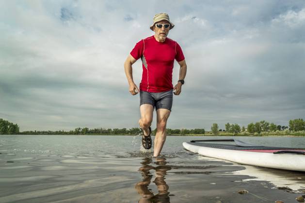 senior paddler with stand up paddleboard senior paddler with stand up paddleboard on, lake shore in northern Colorado with an early summer scenery ,model released, Symbolfoto Copyright: xZoonar.com MarekxUliaszx 9287228 ,model released, Symbolfoto ,property released