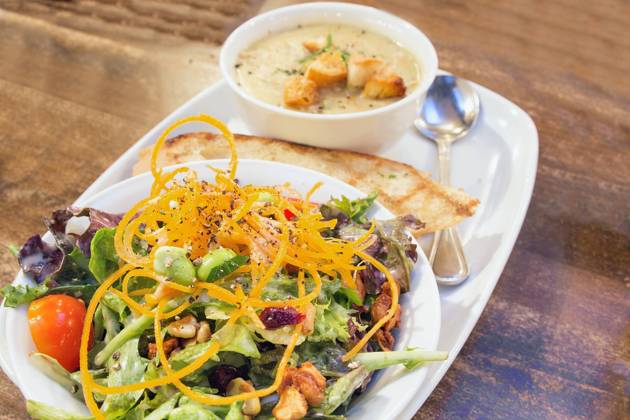Spring Green Salad with Edamame Tomato Cashews Cranberries and Bowl of Corn Chowder Soup Closeup Copyright: JitxLim 32266422