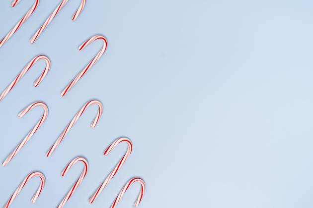 Candy Canes on Blue Background with Copy on the Right Jersey City, New Jersey, United States R_OBVP23111427-1287114-01