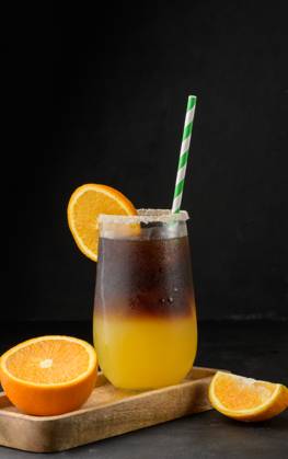 Iced coffee with orange juice in a transparent glass, refreshing bumble coffee on the table Iced coffee with orange juice in a transparent glass, refreshing bumble coffee on the table Copyright: xZoonar.com DANKOxNx 20453469