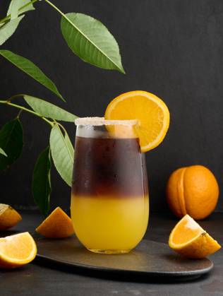 Iced coffee with orange juice in a transparent glass, refreshing bumble coffee on the table Iced coffee with orange juice in a transparent glass, refreshing bumble coffee on the table Copyright: xZoonar.com DANKOxNx 20453562