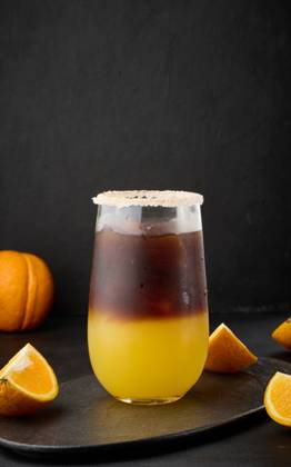 Iced coffee with orange juice in a transparent glass, refreshing bumble coffee on the table Iced coffee with orange juice in a transparent glass, refreshing bumble coffee on the table Copyright: xZoonar.com DANKOxNx 20512234