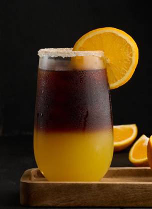 Iced coffee with orange juice in a transparent glass, refreshing bumble coffee on the table, black background Iced coffee with orange juice in a transparent glass, refreshing bumble coffee on the table, black background Copyright: xZoonar.com DANKOxNx 20545636