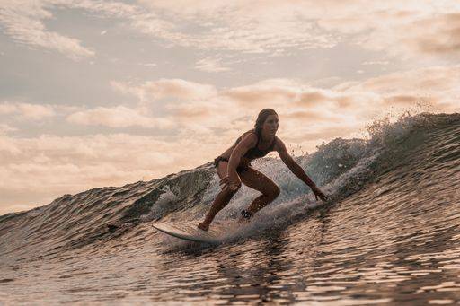 A woman surfing in the Mentawai Islands, Sumatra, Indonesia 302711 ,model released, Symbolfoto RECORD DATE NOT STATED