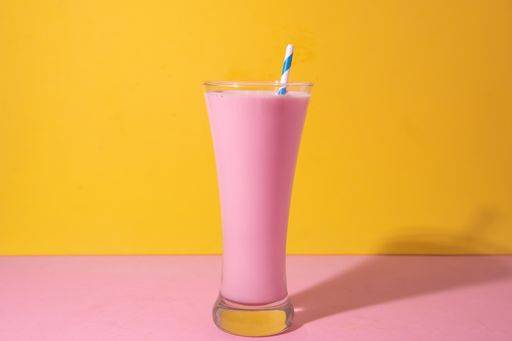 A glass of strawberry smoothie isolated on yellow and pink background 1043359 RECORD DATE NOT STATED