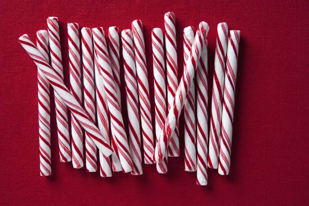 Row of candy canes Los Angeles, California, United States, 29.09.2010, TTBB_BLD084172.jpg, candy, candy cane, christmas, close up, color image, cut out, directly above, festive, food and drink, high angle view, holiday, horizontal, indulgence, large group of objects, nobody, peppermint, photography, red, red background, stick, still life, stripe, studio shot, sweet, temptation, together, tradition, treat, allure, celebration, cheerful, close-up, closeup, color, colour, culture, custom, cut-out, enticement, food, getaway, group, high angle, jolly, luxury, merry, mint, noel, seduction, silhouette, snack, still-life, streak, striate, studio, togetherness, traditional, vacation, vacationing, vegetation, x-mas, xmas, yule, yuletide, Copyright: xJenniferxBoggsx