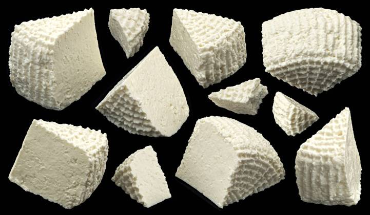 Fresh ricotta slices, homemade organic white cottage cheese on black background Fresh ricotta slices, homemade organic white cottage cheese isolated on black background, full depth of field Copyright: xZoonar.com MaksimxLashcheuskix 21044320