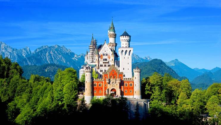 Castle Neuschwanstein in the Sun and green Forest and blue Heaven, at Feet at Allgäu, Bavaria, Germany, Europe Copyright: imageBROKER Dirkxv.xMallinckrodt ibldvm10122918.jpg
