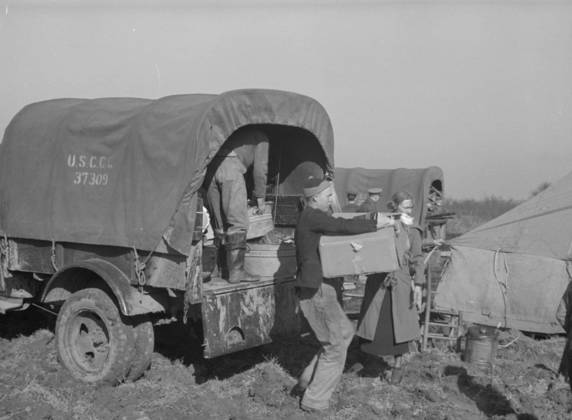 Unloading the household goods of a family who is being moved into the camp for white flood refugees at Forrest City, Arkansas, 1937 (b w photo) 3666449 Unloading the household goods of a family who is being moved into the camp for white flood refugees at Forrest City, Arkansas, 1937 (b w photo) by Evans, Walker (1903-75); Private Collection; (add.info.: Photograph taken for the U.S. Resettlement Administration: a New Deal U.S. federal agency that, between April 1935 and December 1936, relocated struggling urban and rural families to communities planned by the federal government. ). Copyright: xBridgemanxImagesx 3666449