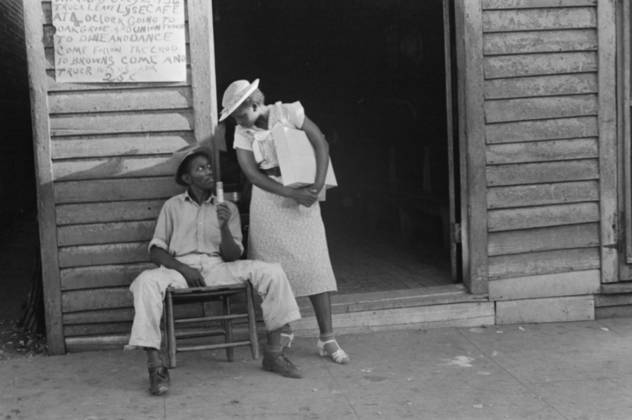 Sidewalk scene in Alabama, 1936 (b w photo) 3666460 Sidewalk scene in Alabama, 1936 (b w photo) by Evans, Walker (1903-75); Private Collection; (add.info.: Photograph possibly taken for the U.S. Resettlement Administration: a New Deal U.S. federal agency that, between April 1935 and December 1936, relocated struggling urban and rural families to communities planned by the federal government. ). Copyright: xBridgemanxImagesx 3666460