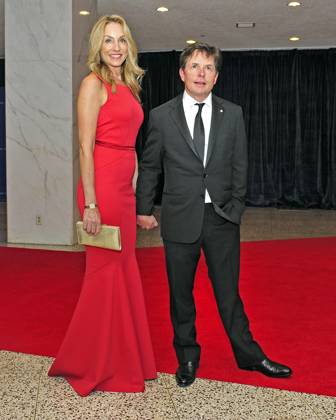 Michael J. Fox and his wife, Tracy Pollan, arrive for the 2013 White House Correspondents Association Annual Dinner at the Washington Hilton Hotel on Saturday, April 27, 2013..Credit: Ron Sachs CNP.(RESTRICTION: NO New York or New Jersey Newspapers or newspapers within a 75 mile radius of New York City) EDITORIAL USE ONLY Copyright: xx x cnpphotos044451