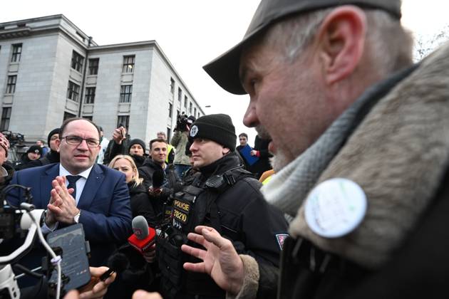 Czech Agriculture Minister Marek Vyborny (left) is seen in front of the ministry s headquarters with farmers who gathered in protest against situation in Czech agriculture, in Prague, Czech Republic, on February 19, 2024. Protesters demand that Czech government withdraw from the Green Deal for Europe. (CTKxPhoto MichaelaxRihova) CTKPhotoP2024021901387  CTKPhotoP2024021901387