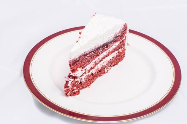Red velvet cake Red velvet cake is very dramatic looking with its bright red color sharply contrasted by a white cream Copyright: xZoonar.com MassimoxLamax 7345759