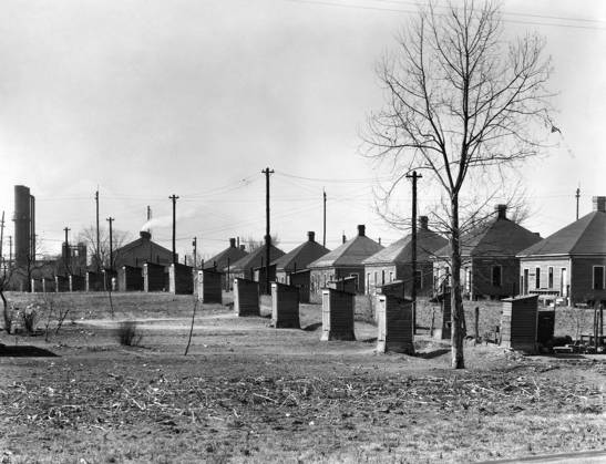 ALABAMA: HOUSING, 1936. Steelmill workers company housing with outhouses at the Republic Steel Company, Birmingham, Alabama. Photograph by Walker Evans in March 1936.  Copyright: xGRANGERx xGRANGERx 0029086