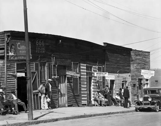 BARBERSHOPS, 1936. A row of African American barbershops in Vicksburg, Mississippi. Photograph, by Walker Evans, 1936.  Copyright: xGRANGERx xGRANGERx 0030398