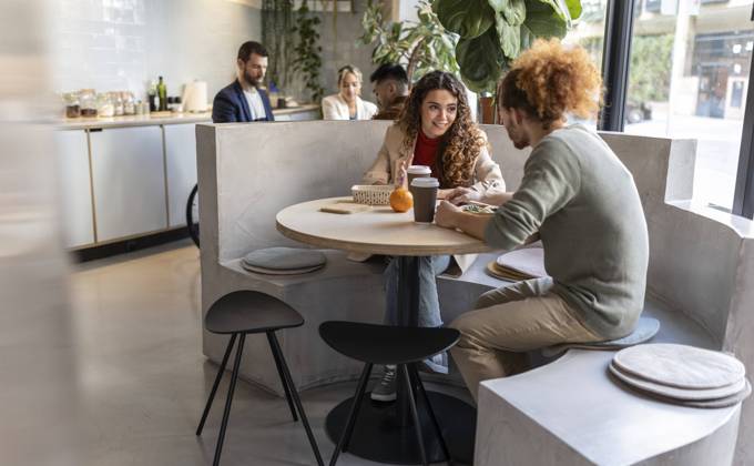 Business colleagues having lunch sitting on seat at office cafe model released, Symbolfoto property released, JCCMF11306