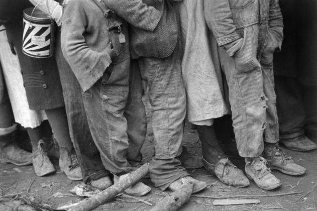 FLOOD REFUGEES, 1937. African Americans in line at mealtime in a flood refugee temporary infirmary operated by the Red Cross at Forrest City, Arkansas. Photograph by Walker Evans in February 1937.  Copyright: xGRANGERx xGRANGERx 0120219