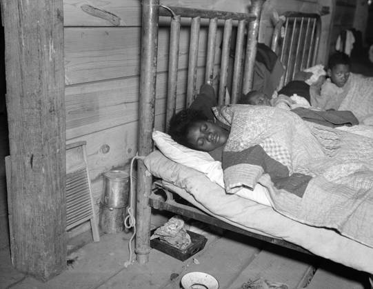 RED CROSS INFIRMARY, 1937. Sick flood refugees in the Red Cross temporary infirmary at a flood refugee camp in Forrest City, Arkansas. Photograph by Walker Evans, February 1937.  Copyright: xGRANGERx xGRANGERx 0323372
