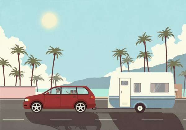 Family on vacation in car, pulling camper trailer along sunny palm trees and ocean  Copyright: MaltexMueller fStopImages2070052