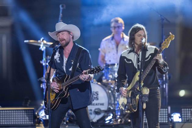 April 5, 2024, Austin, Tx, United States: American country rock band NEEDTOBREATHE with lead singer BEAR RINEHART performs at a taping of CMT Country Crossroads in front of the University of Texas Tower on April 5, 2024. At right is bassist SETH BOLT Austin United States - ZUMAd150 20240405_znp_d150_007 Copyright: xBobxDaemmrichx