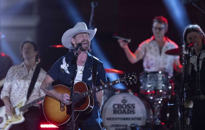 April 5, 2024, Austin, Tx, United States: American country rock band NEEDTOBREATHE with lead singer BEAR RINEHART performs at a taping of CMT Country Crossroads in front of the University of Texas Tower on April 5, 2024. At right is bassist SETH BOLT Austin United States - ZUMAd150 20240405_znp_d150_014 Copyright: xBobxDaemmrichx