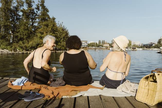 Rear view of female senior friends having fun while sitting on houseboat near lake Germany, Berlin, model released, property released Copyright: xMaskotx , MA108710 MA108710
