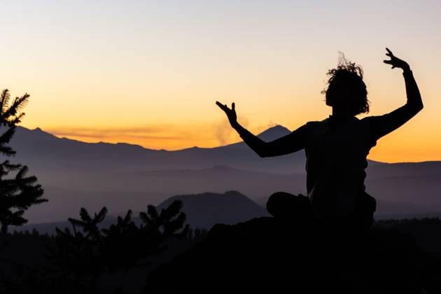A dancer s silhouette is captured against the vibrant hues of a mountain sunset, reflecting a tranquil yet invigorating scene Model Released EduardoGavira_ID20613_608865_006 Copyright: xEduardoxGavirax