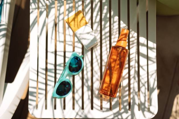 Sunscreens, sunglasses and a delicious chilled cocktail on the pool table Sunscreens, sunglasses and a delicious chilled cocktail on the pool table. Mock-ups of cosmetics and lemonade next to the chaise longue. A delicious cooling drink on vacation at the hotel. Copyright: xZoonar.com DashaxPetrenkox 21476375