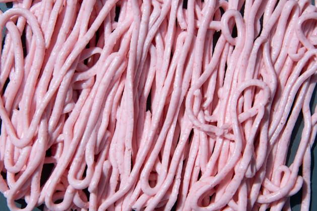 pink tarama pasta on a gray plate squeezed out of a cooking bag,creative texture pink tarama pasta on a gray plate squeezed out of a cooking bag, creative texture. High quality photo Copyright: x