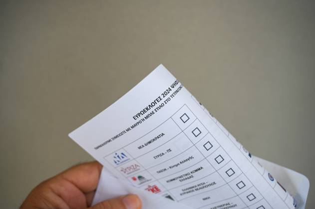 Greece introduces postal voting in EU elections for the first time A voter holds a postal ballot and an envelope for the upcoming EU elections. About 200,000 Greeks residing in Greece and 127 countries abroad have registered for postal voting which is being implemented for the first time in an election in Greece. Athens Greece Copyright: DimitrisxAspiotis