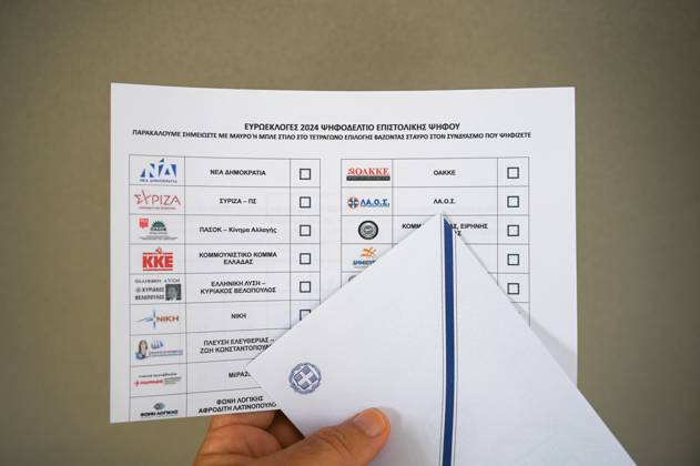 Greece introduces postal voting in EU elections for the first time A voter holds a postal ballot and an envelope for the upcoming EU elections. About 200,000 Greeks residing in Greece and 127 countries abroad have registered for postal voting which is being implemented for the first time in an election in Greece. Athens Greece Copyright: DimitrisxAspiotis