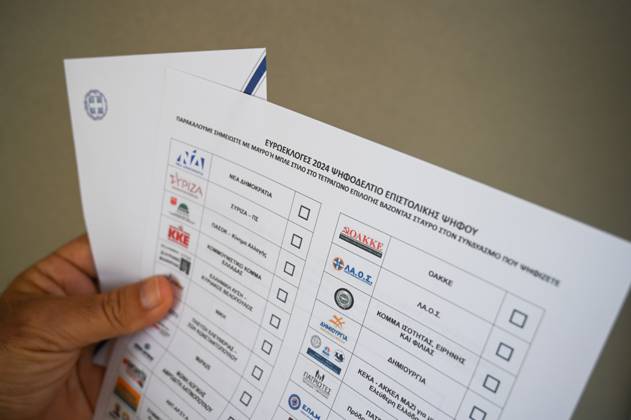 Greece introduces postal voting in EU elections for the first time A voter holds a postal ballot and an envelope for the upcoming EU elections. About 200,000 Greeks residing in Greece and 127 countries abroad have registered for postal voting which is being implemented for the first time in an election in Greece. Athens Greece Copyright: DimitrisxAspiotis