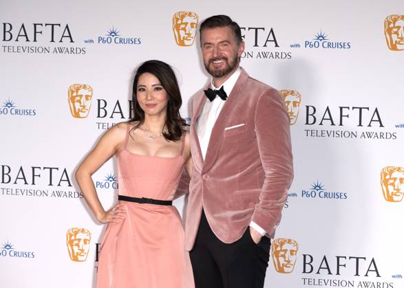 Jing Lusi and Richard Armitage attends the BAFTA Television Awards with P&O Cruises, at the Royal Festival Hall in London, England. UK. Sunday 12th May 2024 - Copyright: xJamesxWarrenx FP_BAFTA_TV_Awards_Press_Room_053